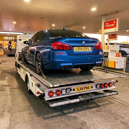 BMW M5 being recovered at Shell petrol station in Essex